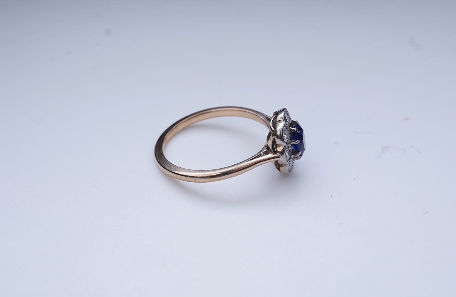 A synthetic sapphire and diamond ring